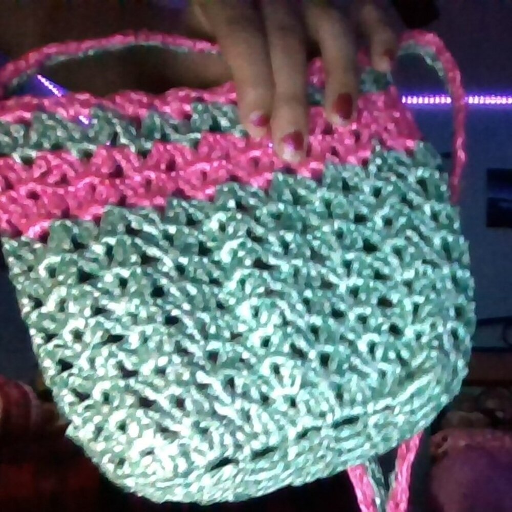 Hand-crocheted pouch in minty turquoise with bubblegum pink trim